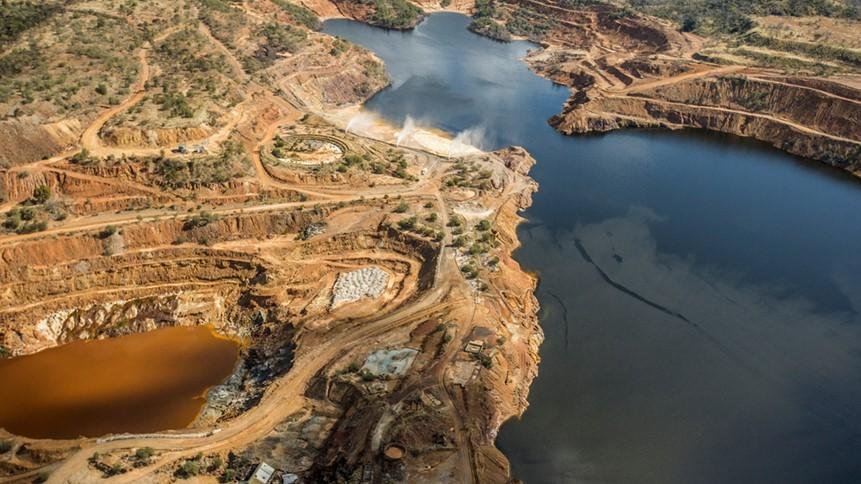 How do mining companies monitor and mitigate the impact of in-situ mining on surrounding ecosystems and water resources?